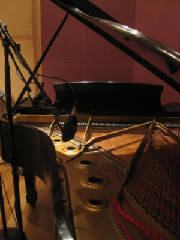 photo of piano in recording studio
